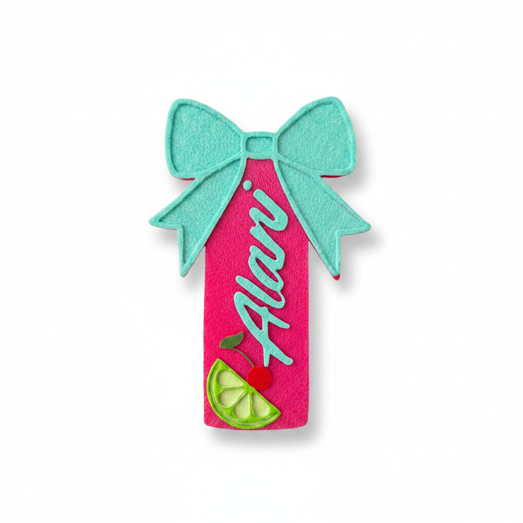 Pink and teal decorative item with 'Alani' text held by a hand