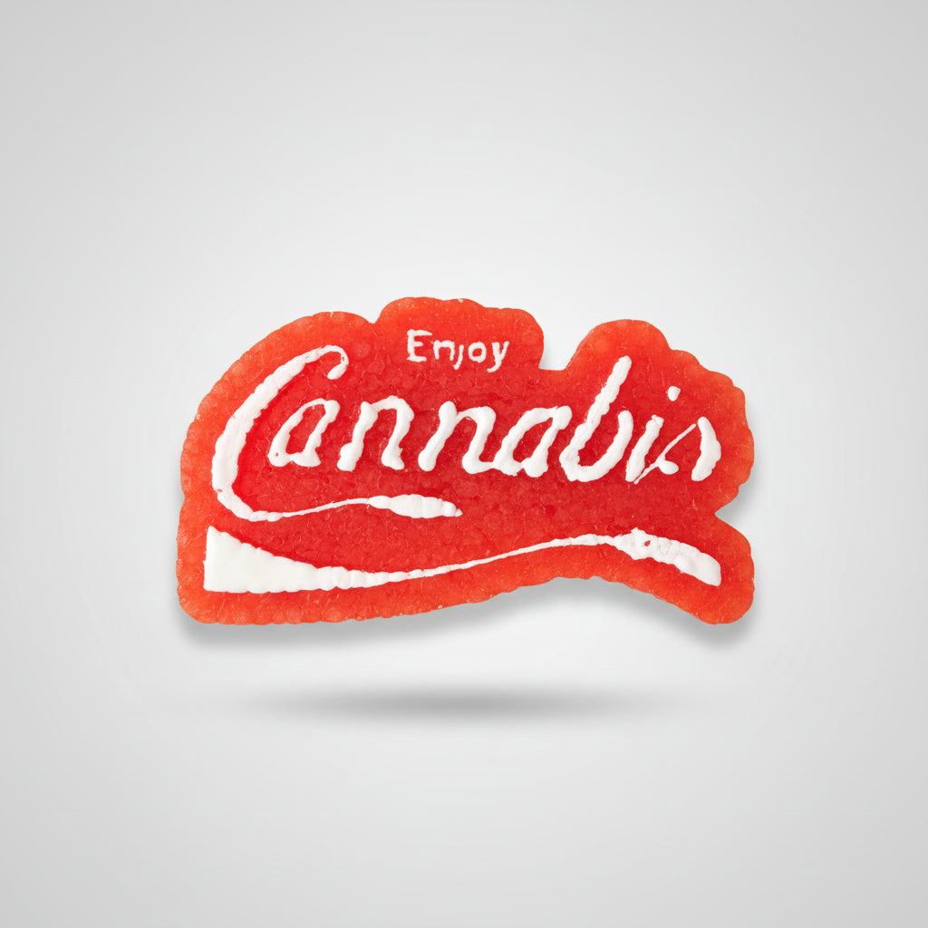 Cannabis-themed product with 'Enjoy Cannabisa' text on a wooden surface