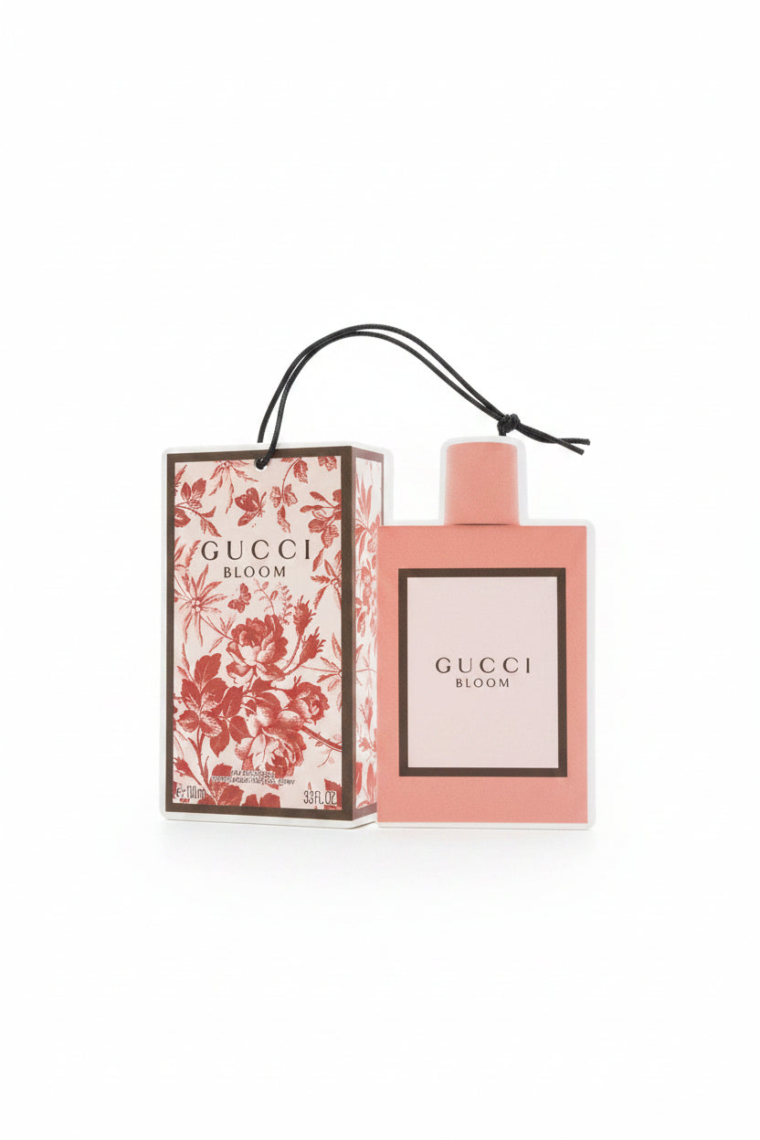 Gucci Bloom perfume bottle and packaging on a white background