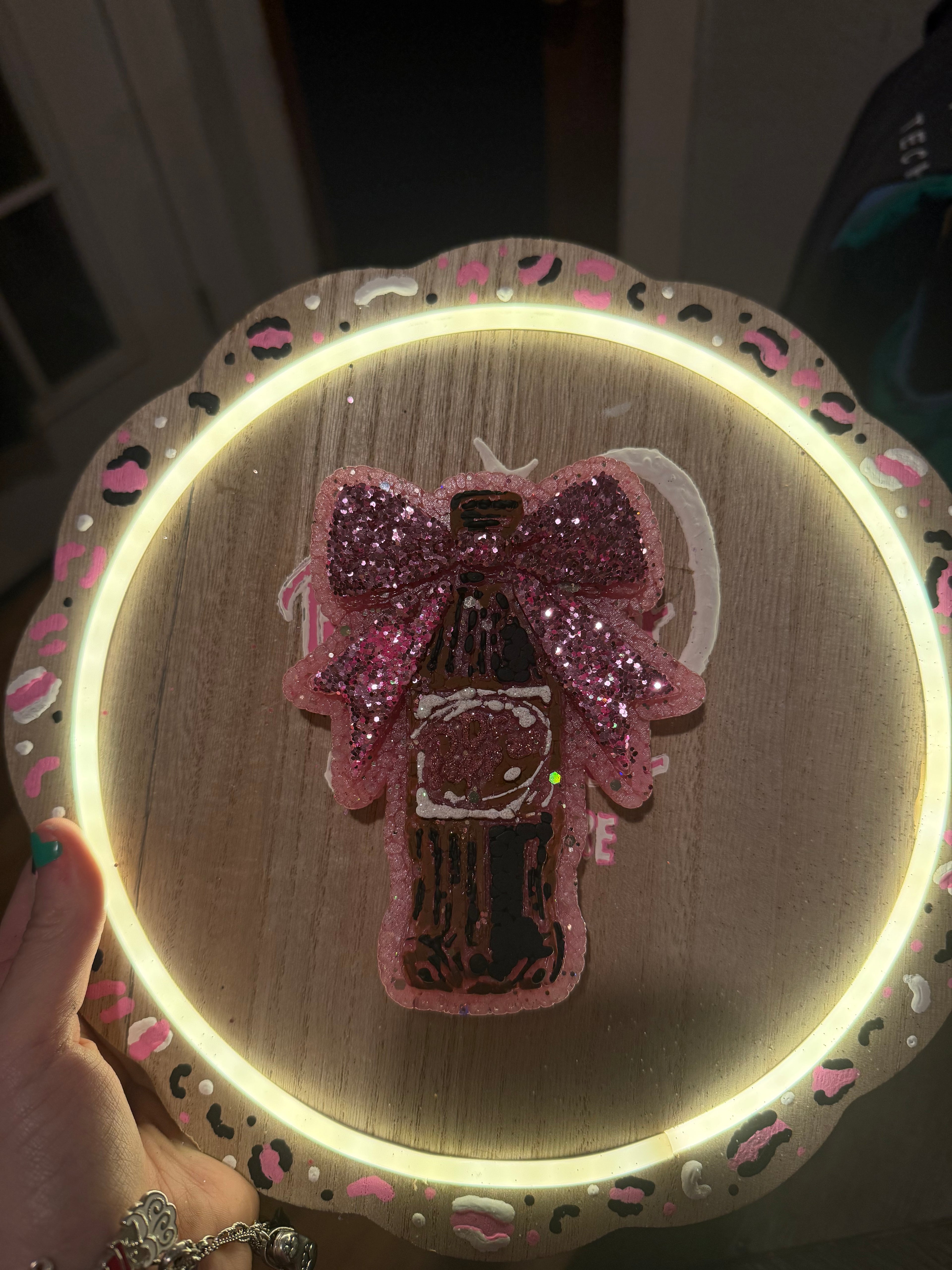 Dr Pepper freshie with pink glittery design and glowing light behind product